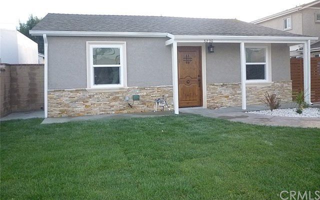 Front of house showing new paint, dual pane windows, sod and landscaping