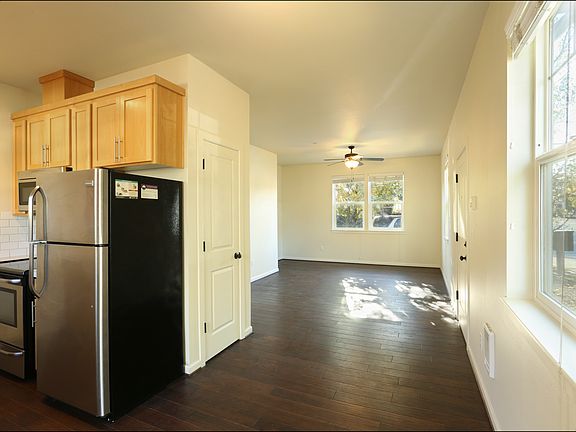 looking south to living room, kitchen on left