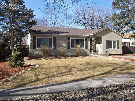 Mature trees, well-maintained landscaping, and auto sprinklers.