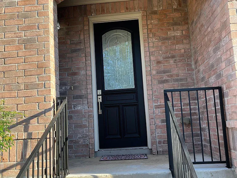 Beautiful Dark Door with nickel accents elegant entry