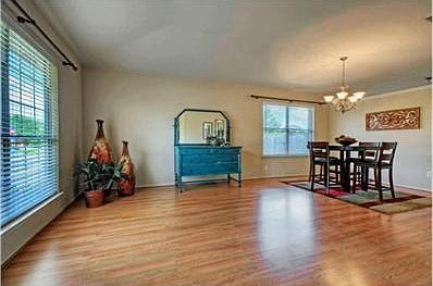 The formal living area, which is open to the formal dining area,