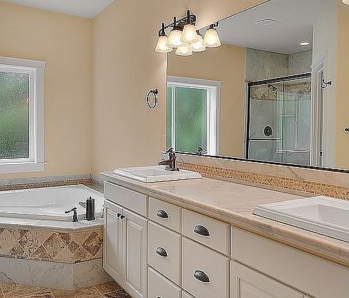 Check out the vessel sinks, and terrazzo tile
