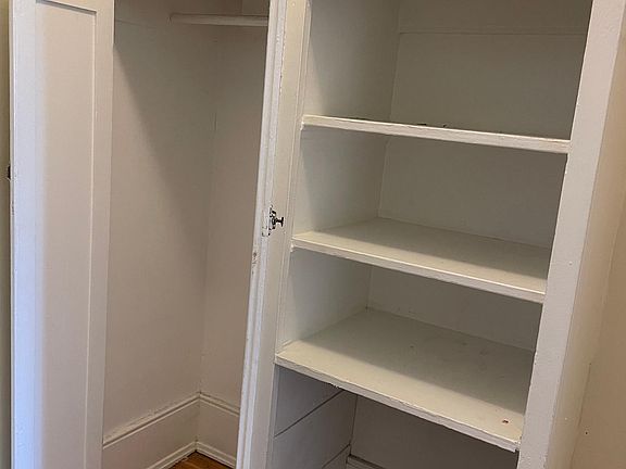 Dressing nook with shelves and closet
