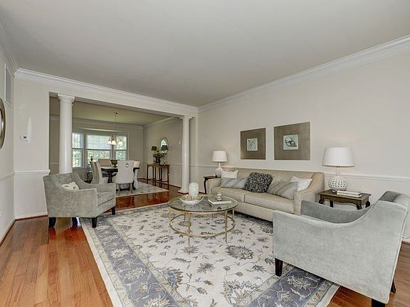 Living Room w/ wainscoting and hardwoods