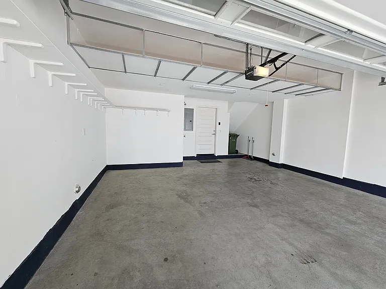 Large 2 car garage, very spacious, also have installed additional shelves on the side and on top for storage