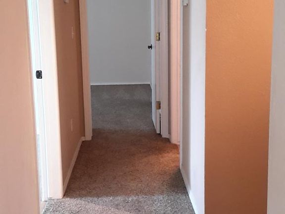 Hallway leading into master bedroom