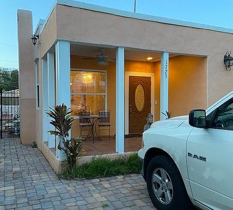 Front of the house with covered porch and parking for 2 cars