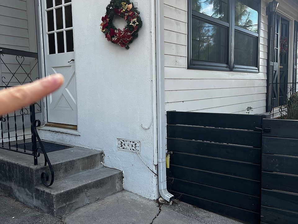 Private entrance through white door located in front of house. As you can see, this is an attached unit to main house. Black door denotes main entrance to home.