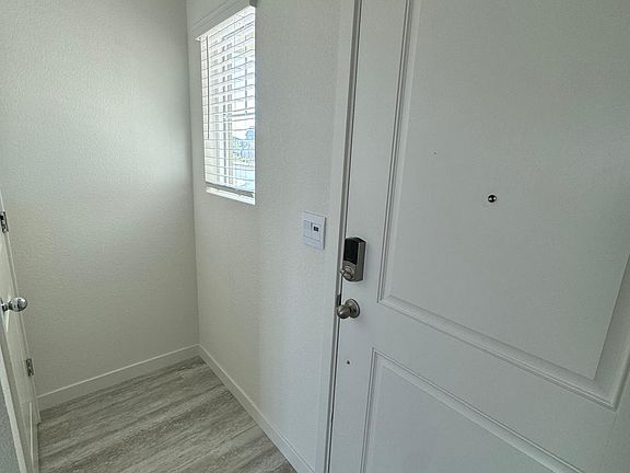 Entrance door. Storage space right in front of the window