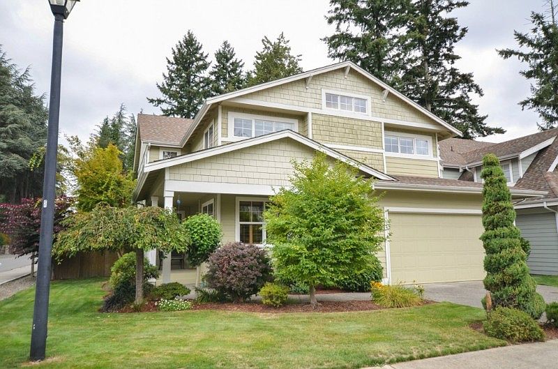 Corner lot with great street appeal. Huge 3 car garage with a door to out back. You will be delighted when  you see the views out of the windows of this home.  Mature Landscaping ~ no waiting for it to feel like home ! 