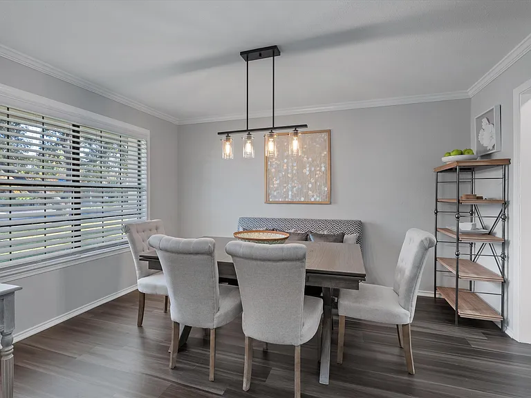 Formal Dining Room with Expandable Table and bench seating. Seats up to 8 with 4 more seats at Kitchen Island.