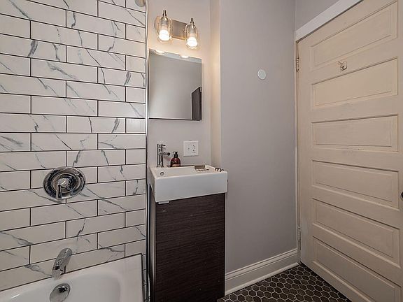 Brand new bathroom - fresh renovation with new fixtures and tile