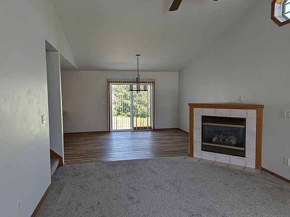View of living room and dining room from front entrance.