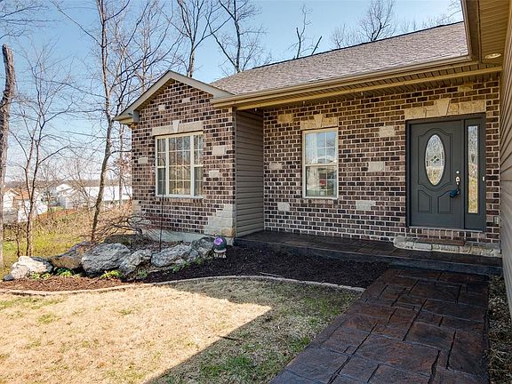Beautiful stamped concrete sidewalk & porch too!