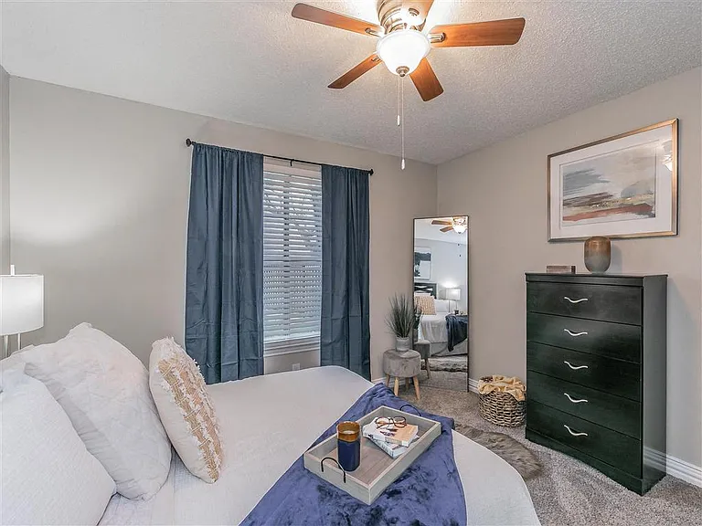 Comfortable bedroom with natural light and ample closet space.
