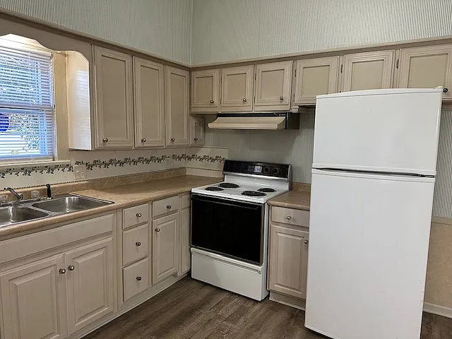 kitchen range and refrigerator furnished and garbage disposal