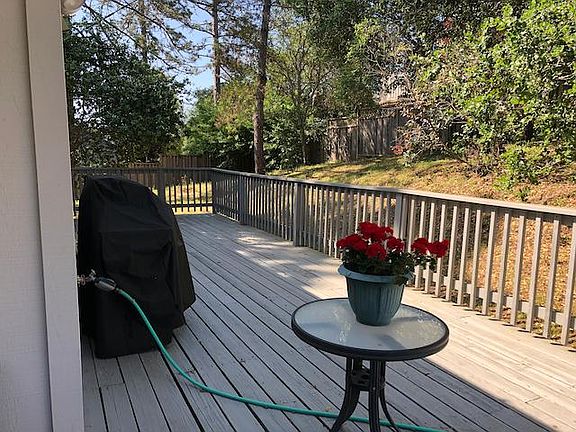 You'll have a nice deck with a gas grill. The trees and fence make it super private.