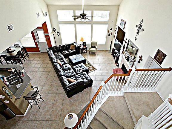 SOCIALIZE WITH FRIENDS AND FAMILY IN THIS LARGE TWO STORY DEN