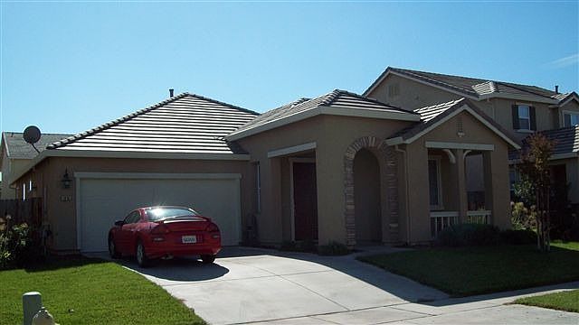 Front of Home, Stone-Accented Archway Over Entry