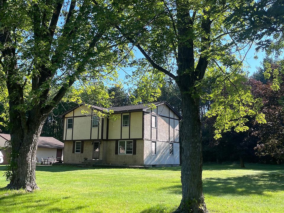 Front of house. 3 acre lot, mature trees and large front lawn .