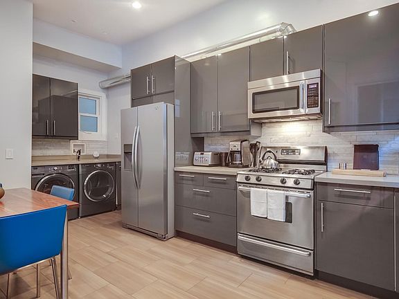 Kitchen with washer and dryer