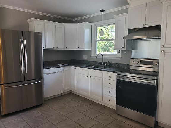 Updated kitchen picture with the new stove. The new stainless steel dishwasher will be installed soon.