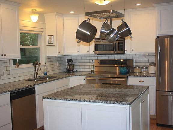 New granite countertops and subway tile backsplash 