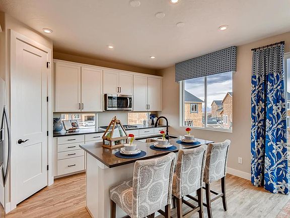 The Solitude Corner Pantry Kitchen in Utah by Century Communities