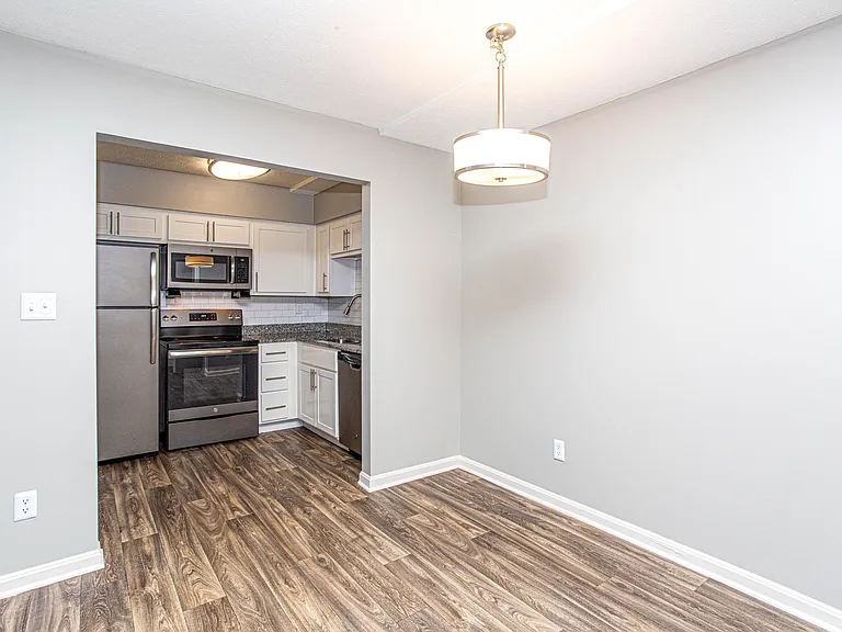 Dining area with hardwood-style flooring