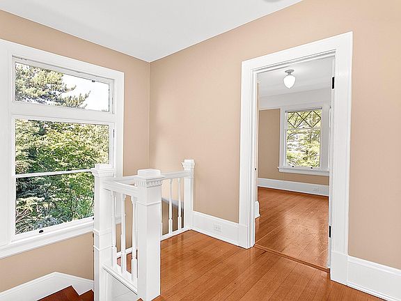 Entry stairs w/large window & landing