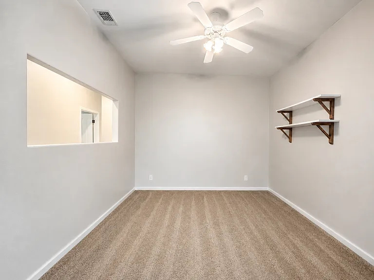 This room can be used as a den, office, playroom, or guest space.