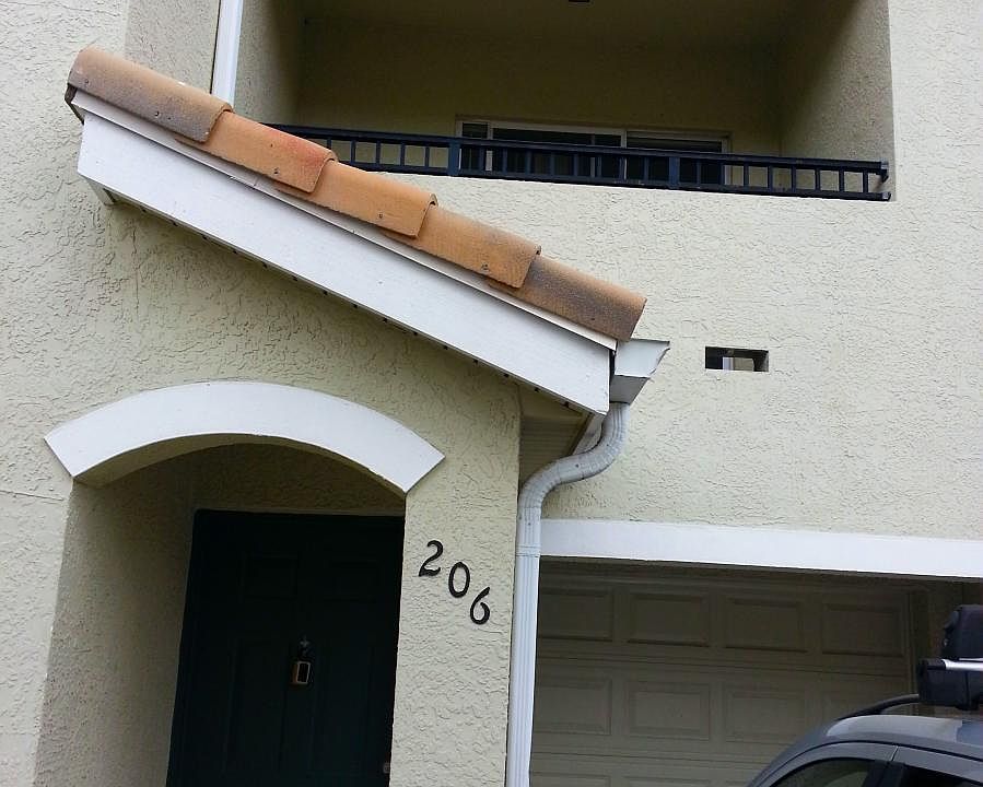Entrance and second floor balcony.