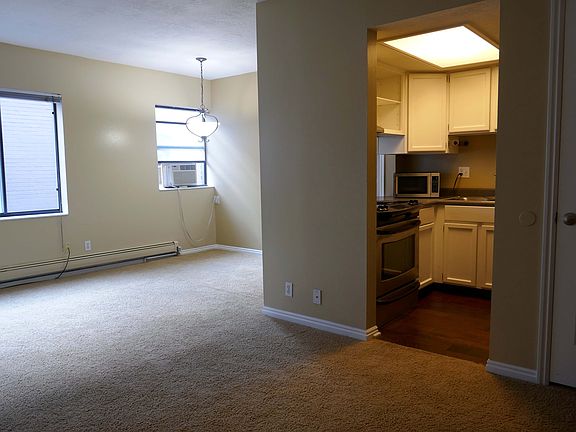 Living room, dining space, kitchen.