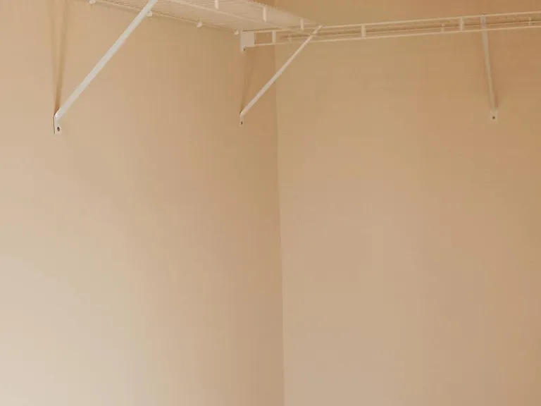 Walk in closet in primary suite.