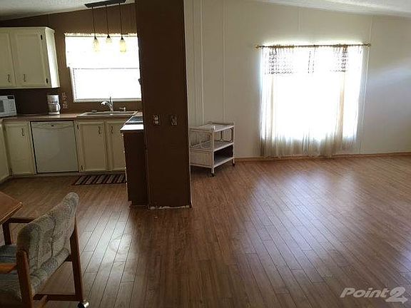 hallway looking into dining room, kitchen & living room