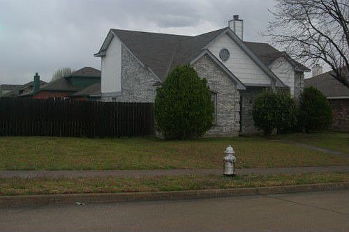 House has great approach on corner!
