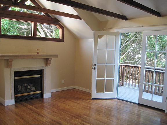 Living Room w/ gas fireplace and french doors to private deck.