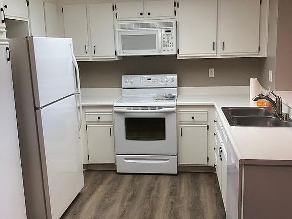 Kitchen with new floors and dishwasher