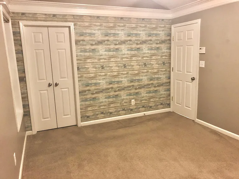 High End Designer Finishes - Reclaimed Wood Style Accent Wall in Master Bedroom