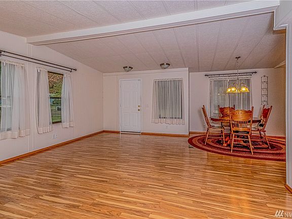 Front door, eating nook and kitchen is to the right with a formal living area. 