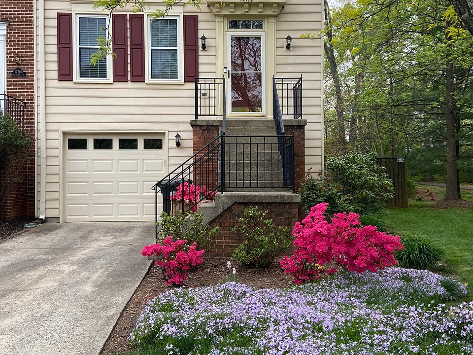 Front exterior with one-car garage and driveway