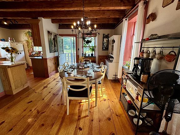 Remodeled hardwood floors and wooden-beam ceilings.
