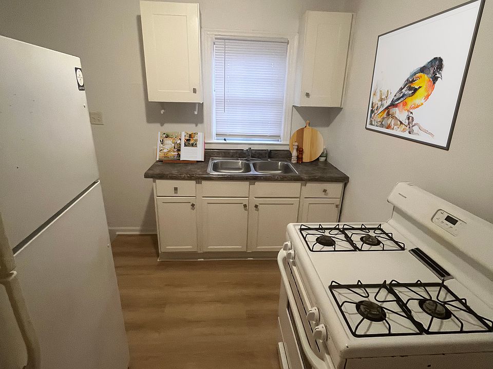 Kitchen with entrance to the backyard and the basement