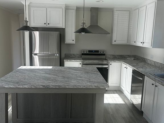 Spacious Kitchen with great lighting and lots of cabinet space.