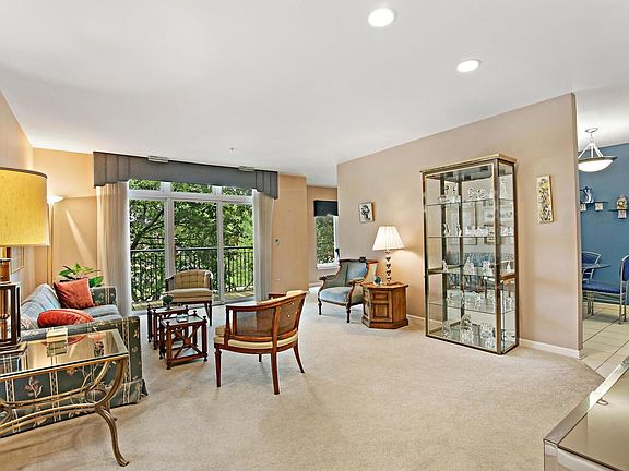 Wide doorways from the living room to the dining room and the kitchen make the condo feel so open