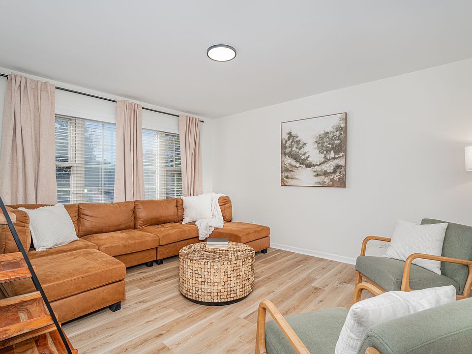 Den with sectional sofa and additional seating