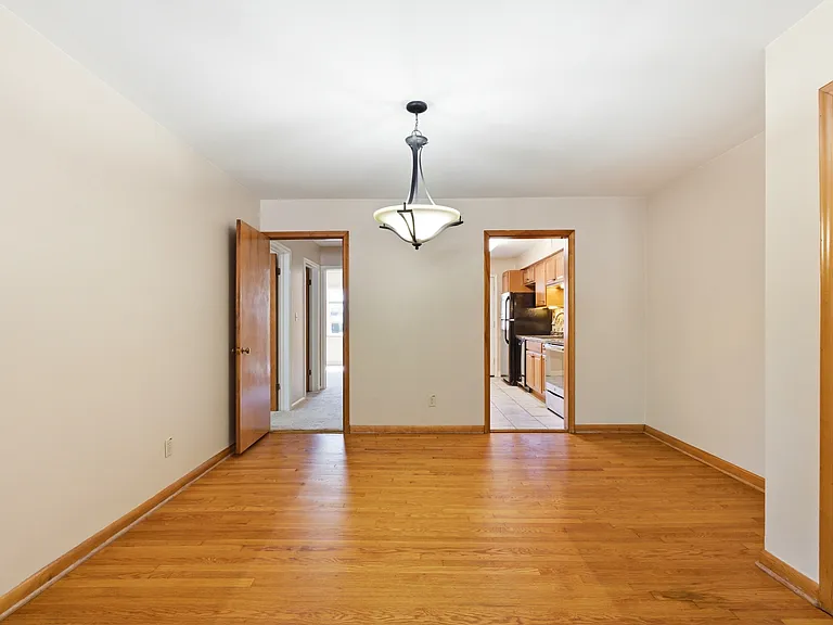 Dining area. Your kitchen to the right. Bedrooms down the hall to the left. You'll pass the bath.