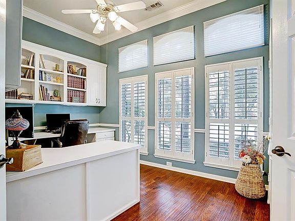 Study with Plantation Shutters, Entrance Doors, Built-Ins and a Closet.