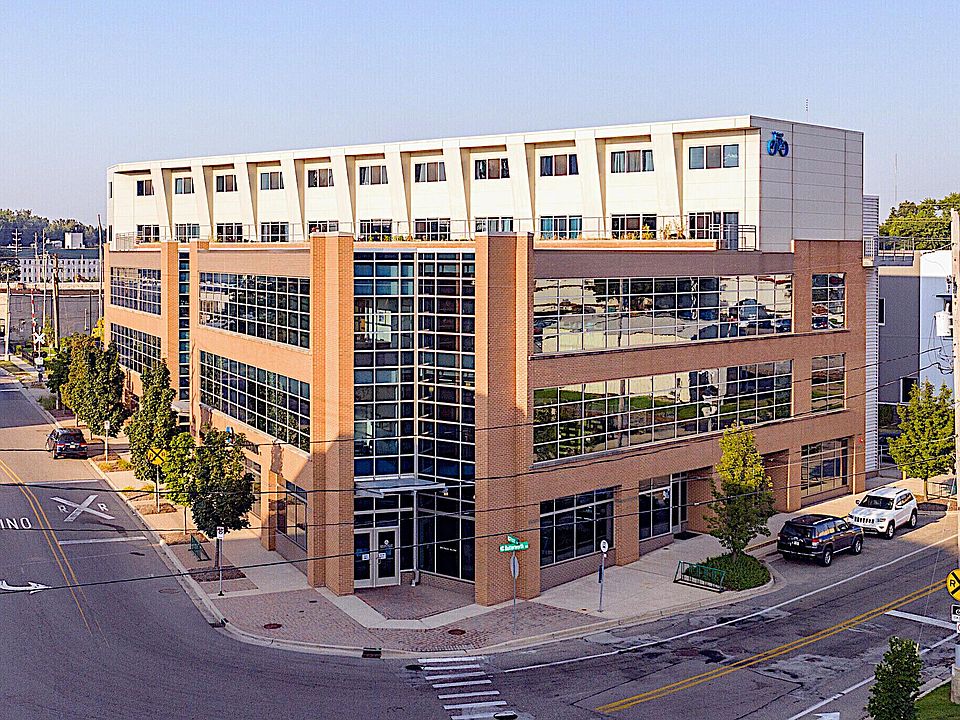 Exterior View looking south from GVSU campus - Top 2 Floors are Apartments.