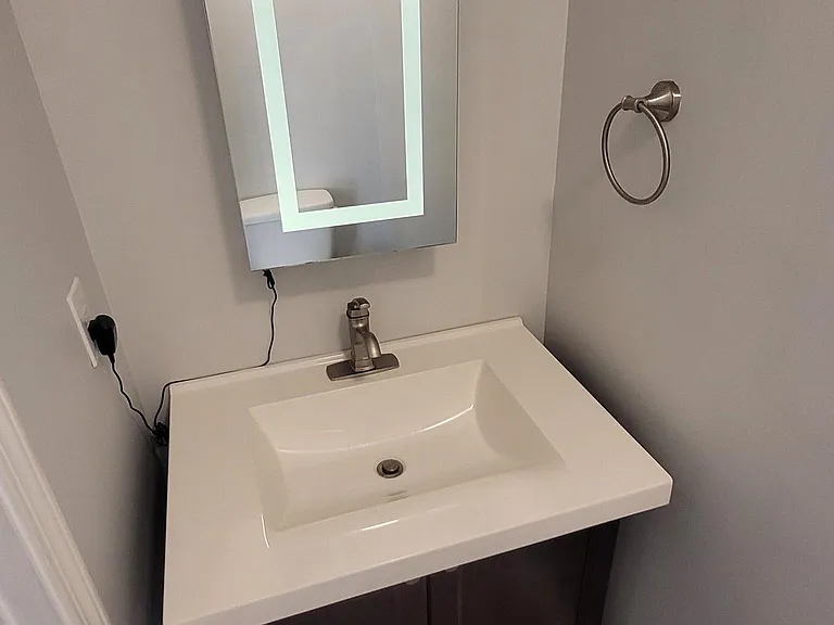 Half bath with sink and toilet